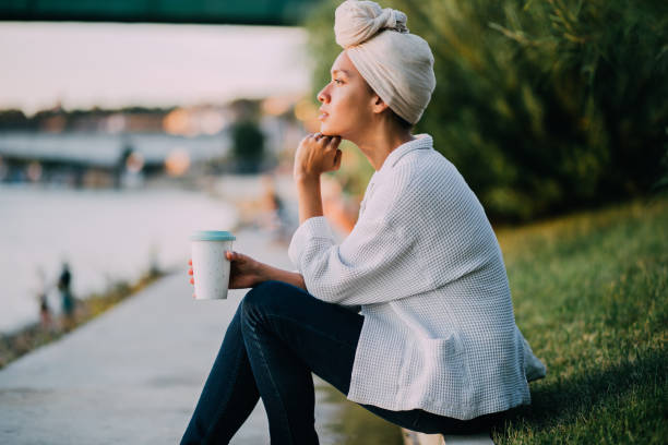 istock Muslim woman having coffee 1173974978