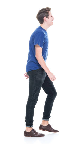 istock Young high school age male walking 1173976600