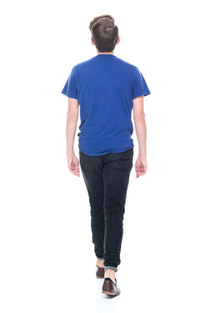 istock Young high school age male walking 1173976631
