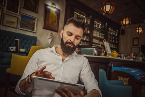istock Young businessman resting in cafe 1173976696