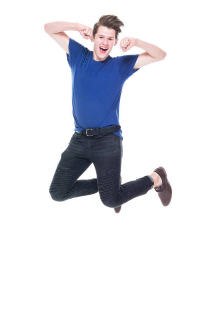 istock Young high school age male jumping 1173976743