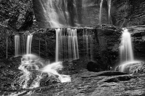 Afternoon winter photo of Lucifer Falls waterfall in Robert H. Treman State Park near Ithaca NY, Tompkins County New York.  (01-13-2024)