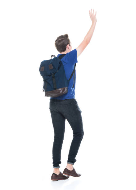istock Young high school age male student is waving 1173977577