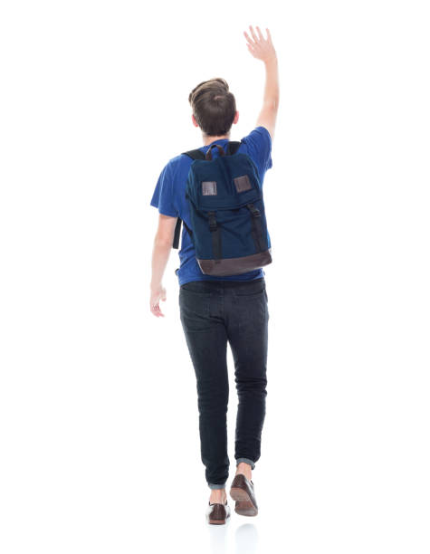 istock Young high school age male student is waving 1173977598