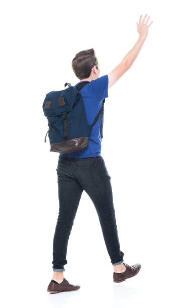 istock Young high school age male student is waving 1173977618