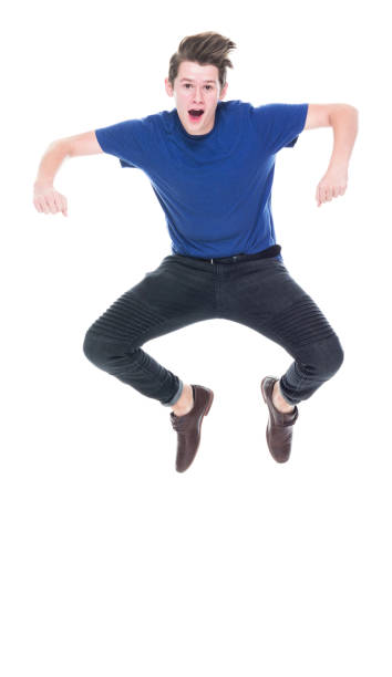 istock Young high school age male jumping 1173977972