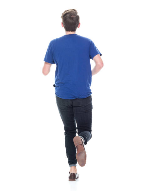 istock Young high school age male running 1173977991