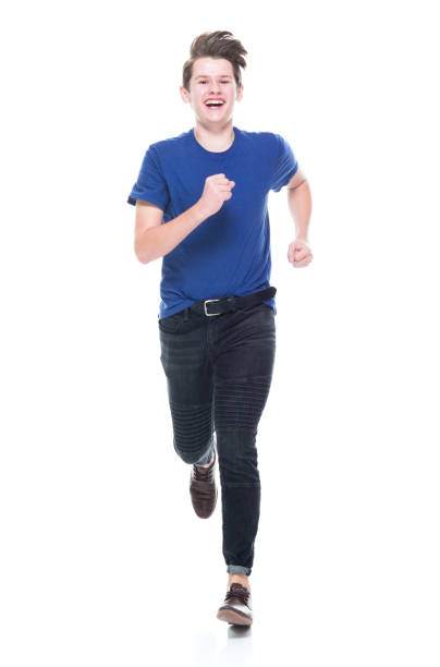 istock Young high school age male running 1173978094