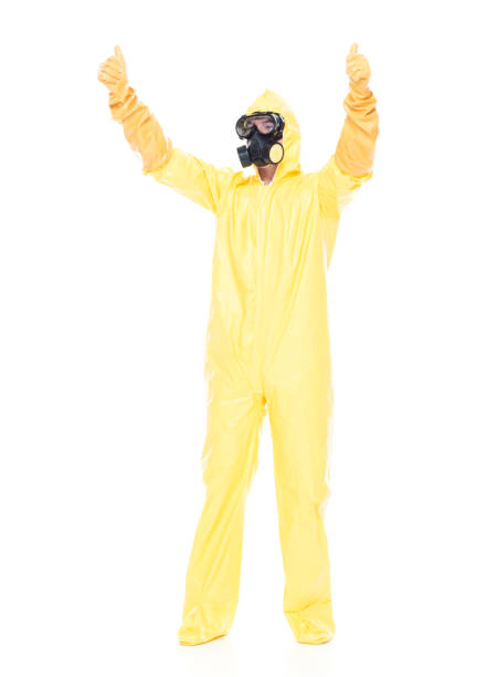 istock Man in protective clothing cheering with hands up 1173978510
