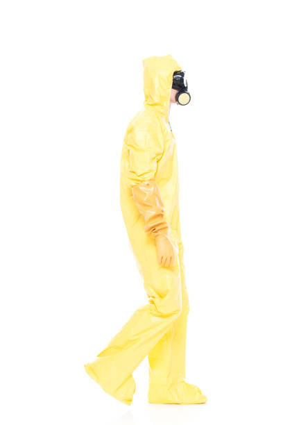 istock Man in protective clothing walking 1173979079