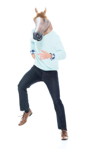 istock Man with horse mask is dancing 1173979457