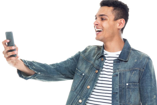 istock Good looking tall black man wearing denim jacket - taking a selfie 1173981838