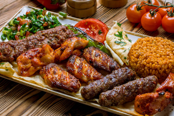 istock assorted kebabs with bulgur and vegetables Turkish cuisine on wooden table 1173982649