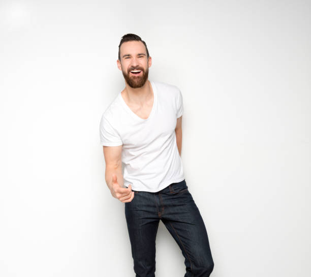 istock Handsome man standing with white shirt on white background 1173982778