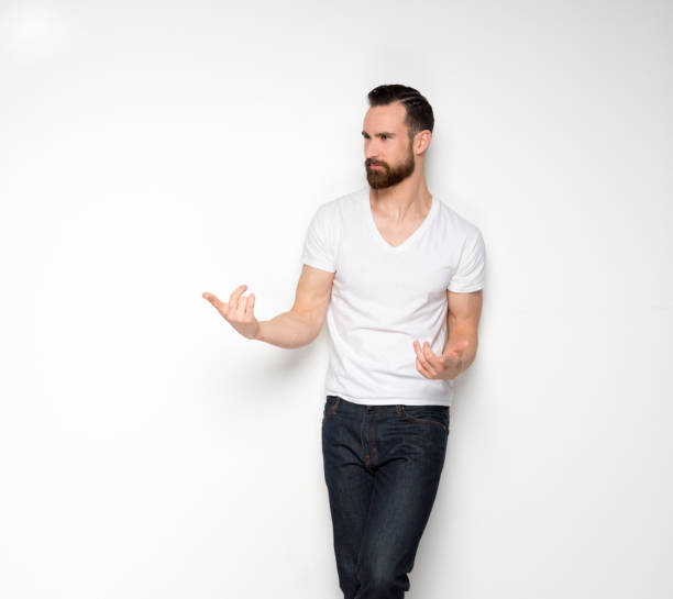 istock Handsome man standing with white shirt on white background 1173983097
