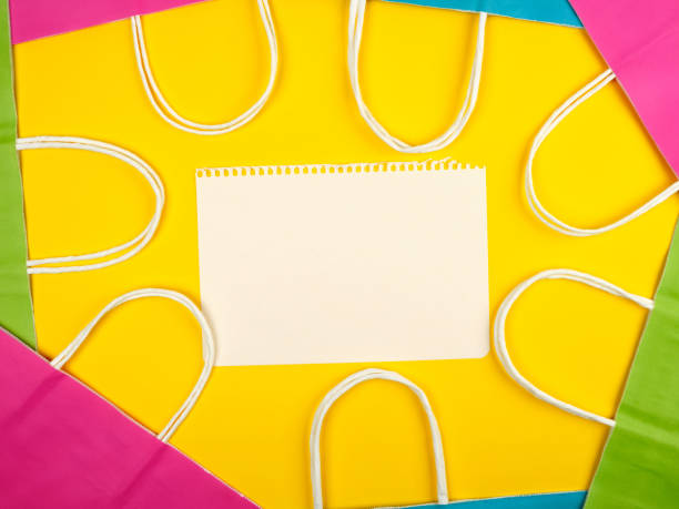 istock blank white sheets and multi-colored paper shopping bags 1173990259
