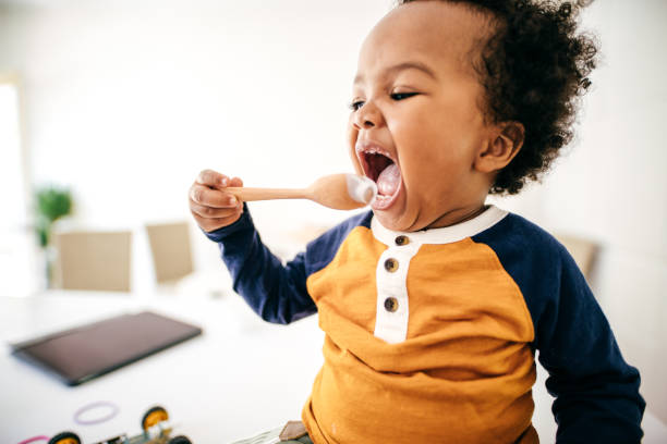 istock Toddler eating yogurt 1173998522