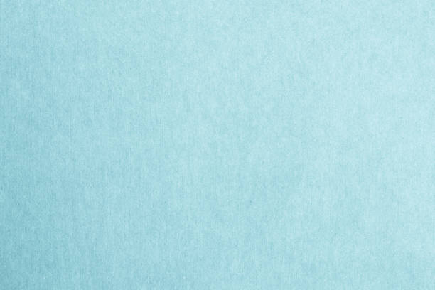 istock Recycled craft paper textured background in light cyan blue color 1173998700