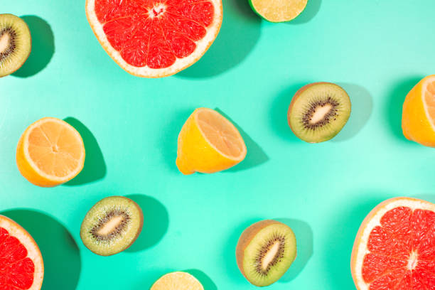 istock Fruits on trendy green background 1173999051