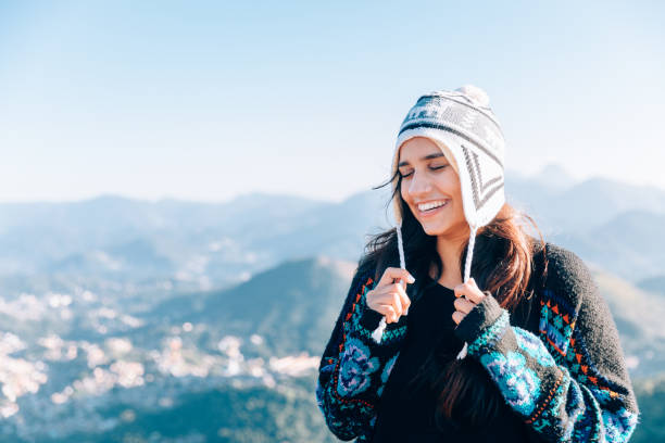 Cute young woman enjoying the outdoors at the mountain Young woman enjoying the outdoors at the mountain glengarry cap stock pictures, royalty-free photos & images