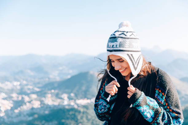 Cute young woman enjoying the outdoors at the mountain Young woman enjoying the outdoors at the mountain glengarry cap stock pictures, royalty-free photos & images