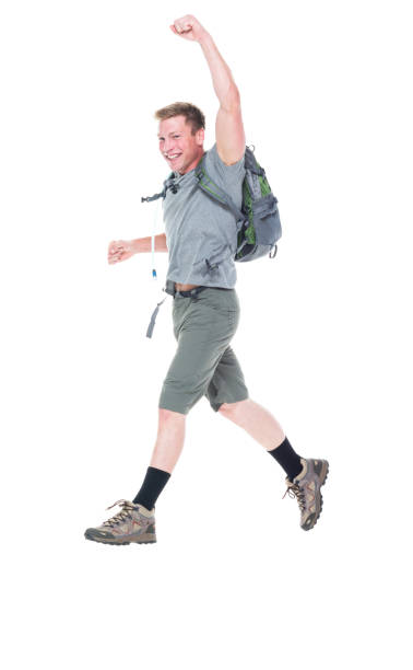 istock Friendly male hiker is jumping with excitement, side view 1174008877