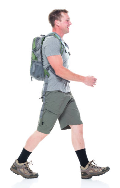 istock Friendly male hiker is happy and walking, sideways 1174008994