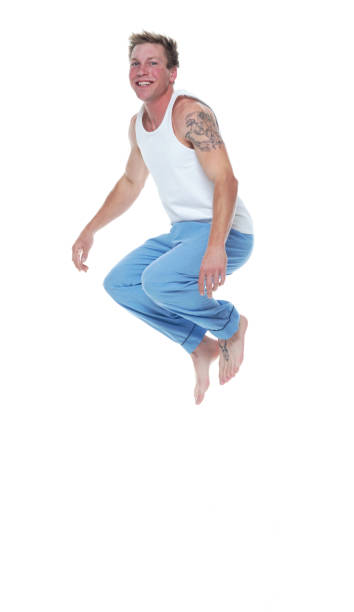 istock Man in pajamas jumping 1174009511