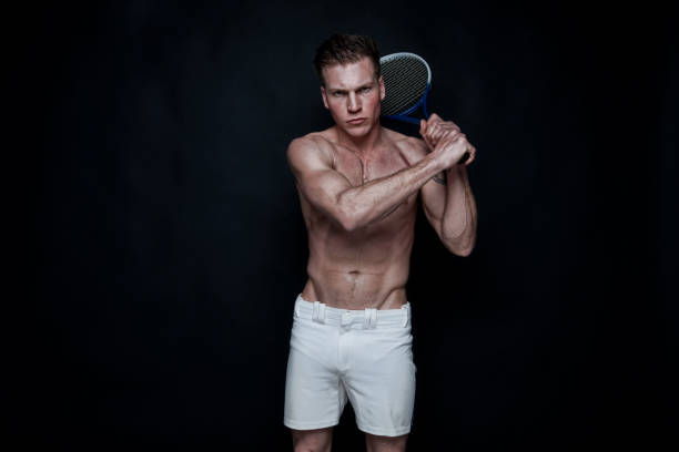 istock Sexy male tennis player 1174011072