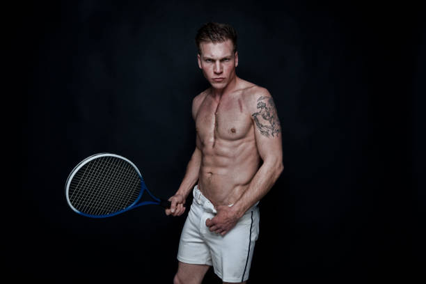 istock Sexy male tennis player 1174011283