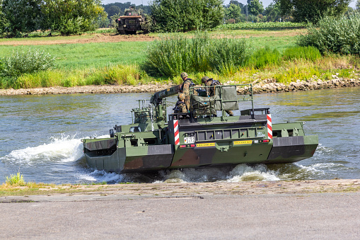 Minden / Germany - September 4, 2019: German tank pioneer battalion trained a tank crossing over a river with M3 Amphibious Rig. The M3 Amphibious Rig is a self-propelled amphibious bridging vehicle.