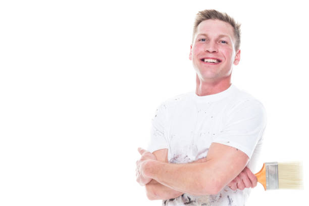 istock Young attractive male painter standing on white background - smiling 1174012252