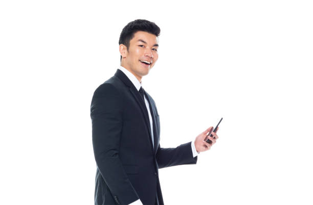 istock Handsome Chinese businessman -holding smart phone 1174016281