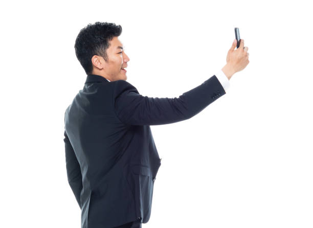 istock Attractive looking Chinese businessman - taking a selfie 1174016466