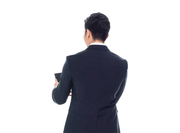 istock Attractive looking Chinese businessman - texting on smart phone 1174016491
