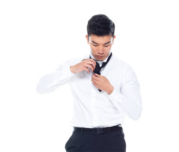 handsome asian man tying a tie - 11262 imagens e fotografias de stock