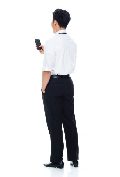 istock Handsome Asian Businessman - texting on smart phone 1174016509
