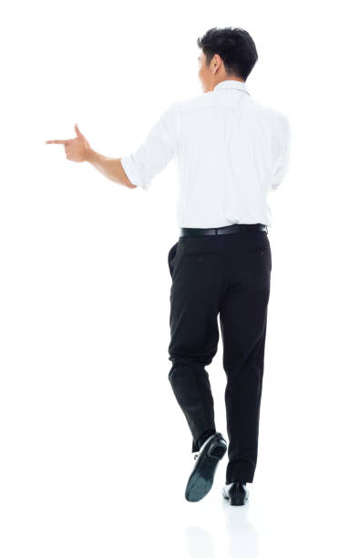 istock Handsome Asian Businessman - rear view walking and doing finger gun 1174016560