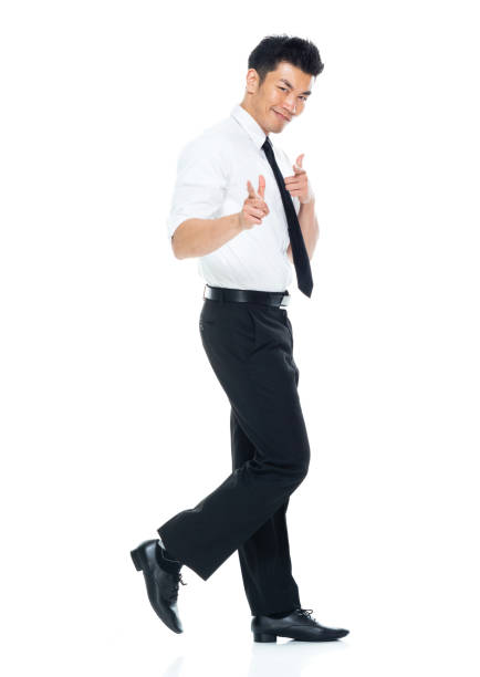 istock Handsome Asian Businessman - side view walking and doing finger gun 1174016594