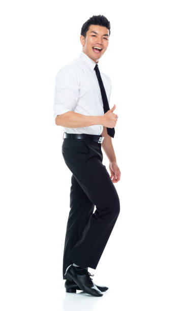 istock Handsome Asian Businessman - side view walking and doing thumbs up 1174016721