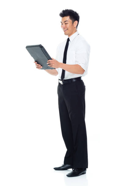 istock Handsome Asian Businessman - using a clipboard 1174016788