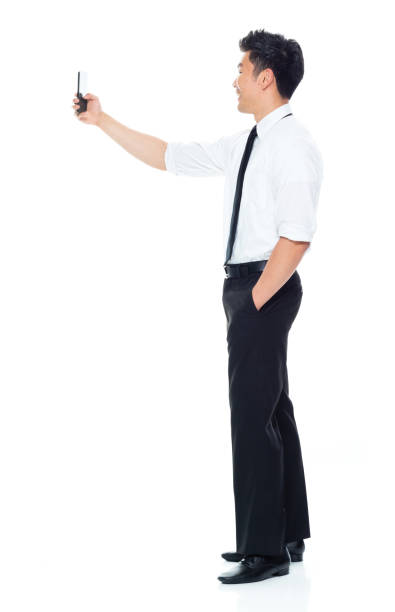 istock Handsome Asian Businessman - taking a selfie 1174016857