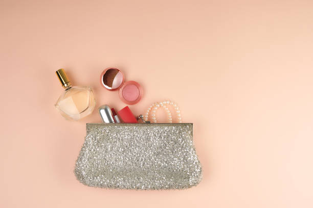 istock open silver clutch and cosmetics fell out of the middle 1174017770
