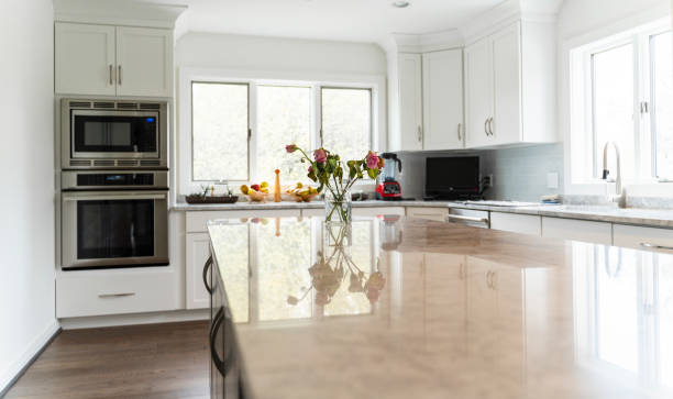 istock Modern kitchen interior in the luxury residential house, with wide windows and natural light. 1174020002