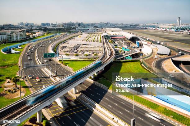 Dubai International Airport And Metro At Sunny Day Stock Photo - Download Image Now