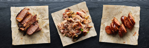 texas bbq with pulled pork, brisket, and hot links texas bbq with pulled pork, brisket, and hot links in flat lay composition brisket photos stock pictures, royalty-free photos & images
