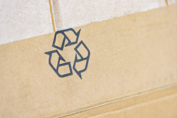 istock recycle concept - recycle logo on parcel package cardboard box 1174023674