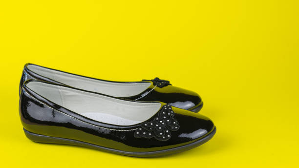 istock Leather leather shoes on bright yellow background. 1174025225