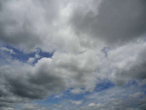 Cumulonimbus cloud formations on tropical blue sky, Nimbus moving , Abstract background from natural phenomenon and grey clouds hunk , Thailand
