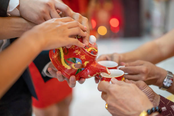 istock Newlywed serving tea to elder on Chinese traditional tea ceremony 1174027572